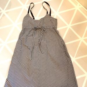 A line thin strapped dress with pockets. Size small. 100% cotton.